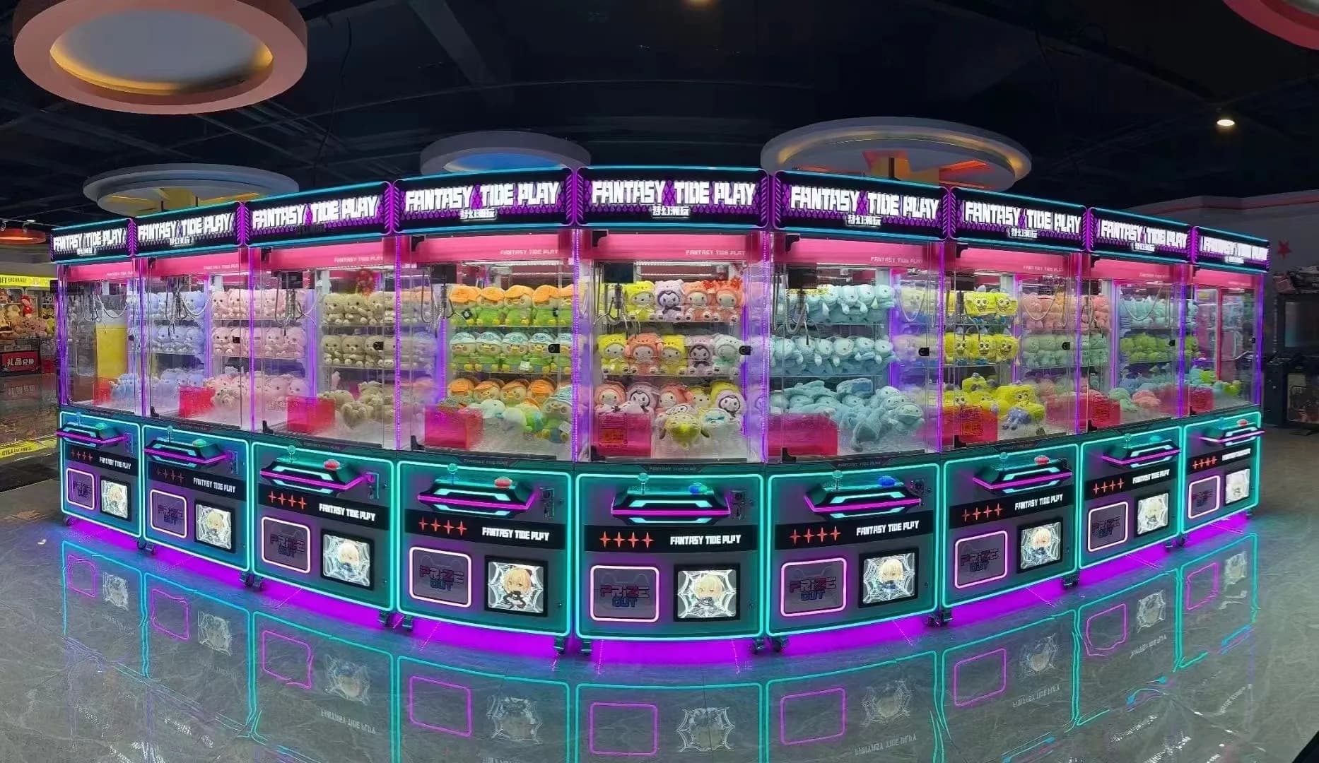 Jisun claw machines lined up in the factory showroom with LED lighting on