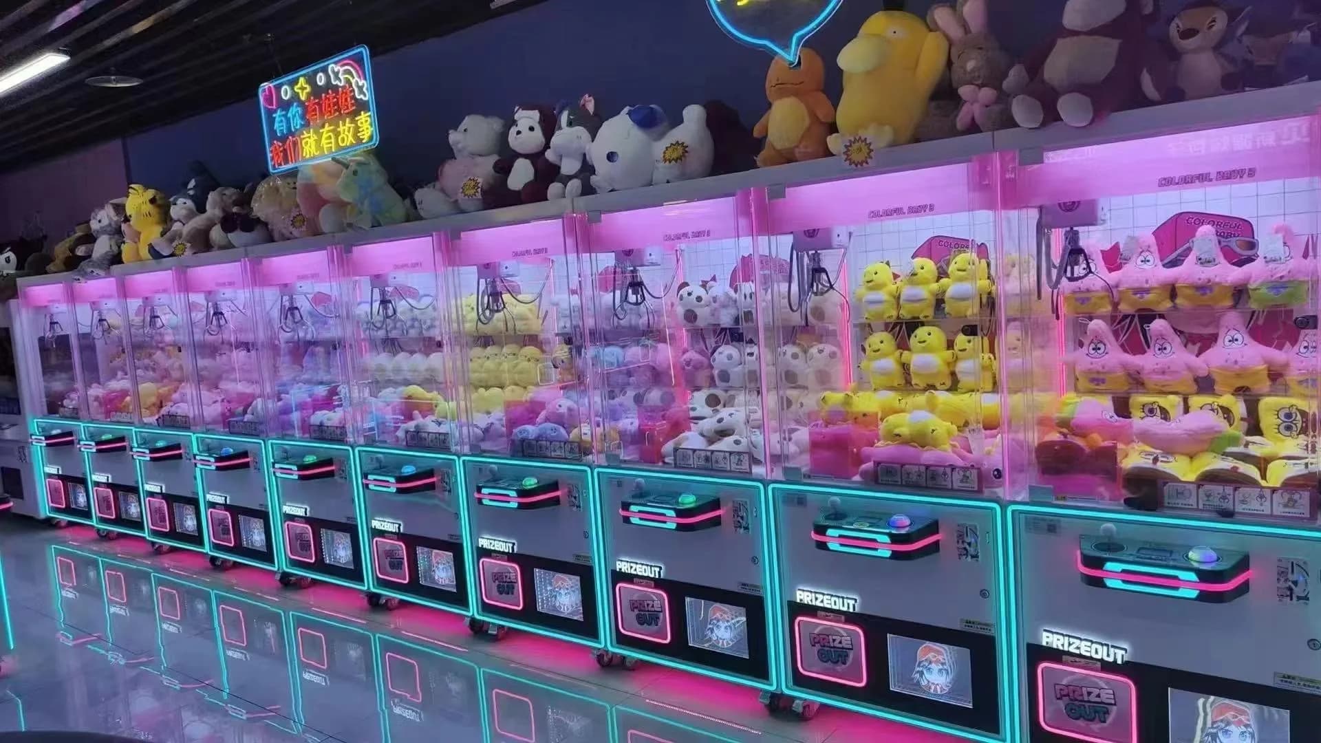 Finished Jisun claw machines arranged in a production row before delivery