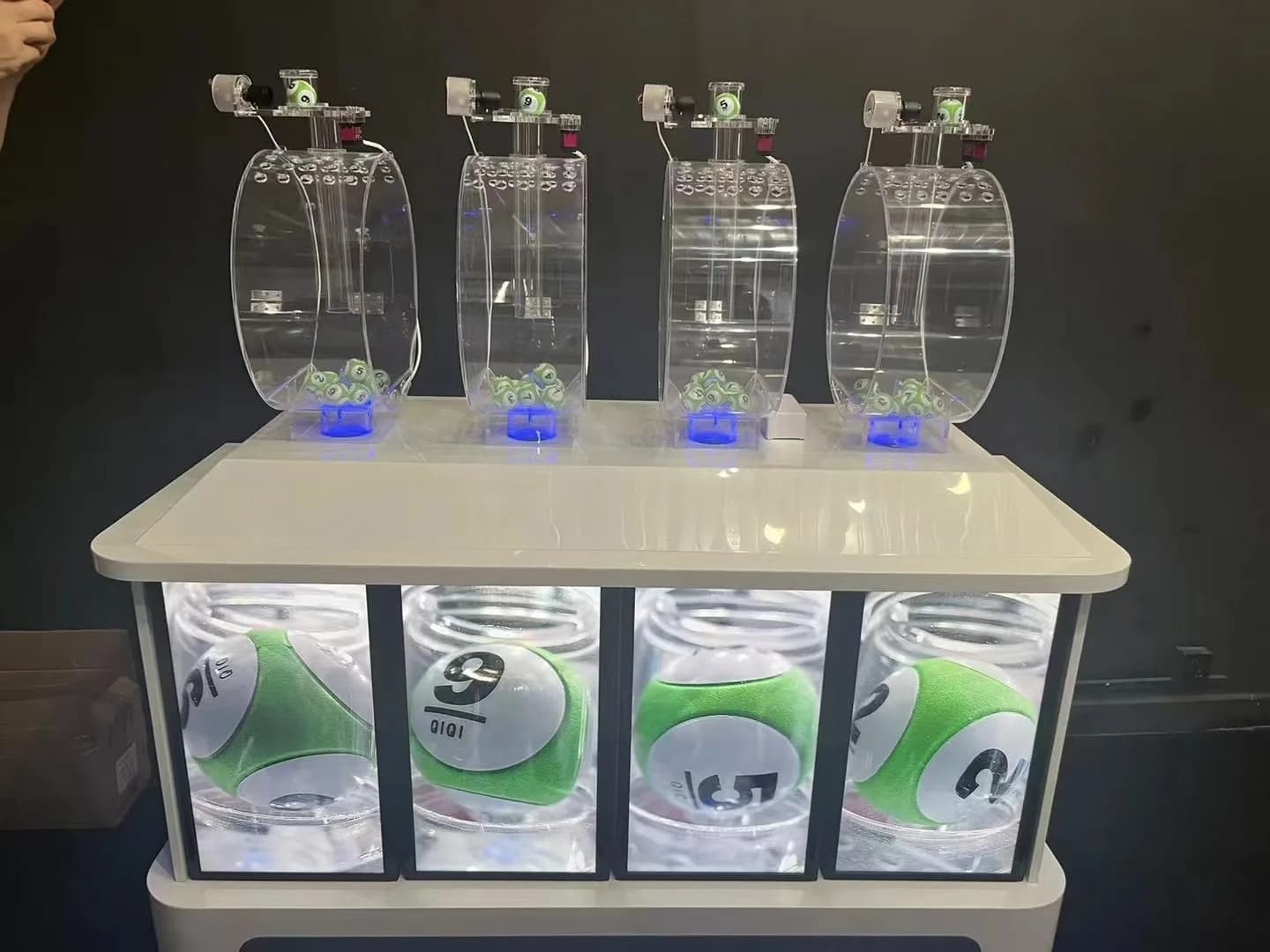 Multi-chamber lottery draw machine with four clear draw units and front number display panels