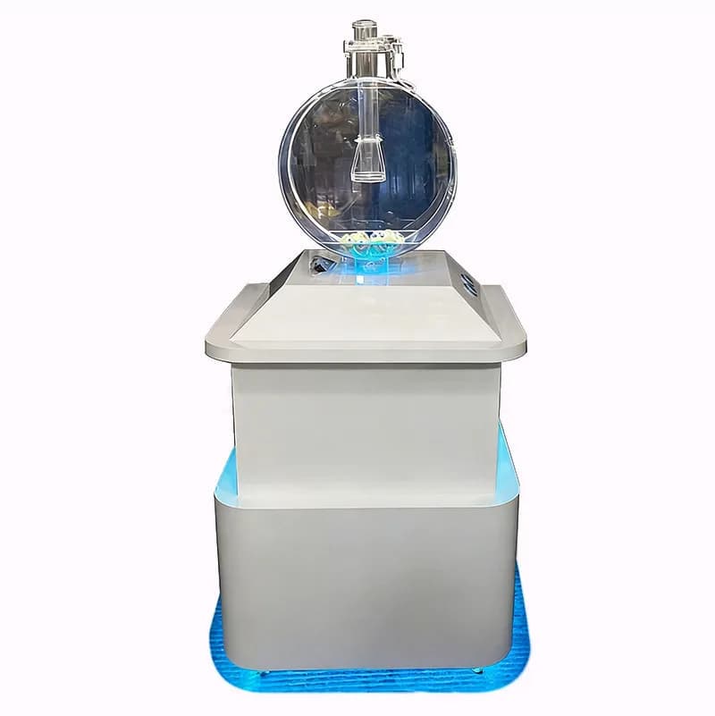 Front view of a white 1D air-blown lotto draw machine with a clear spherical ball chamber and blue LED base lighting