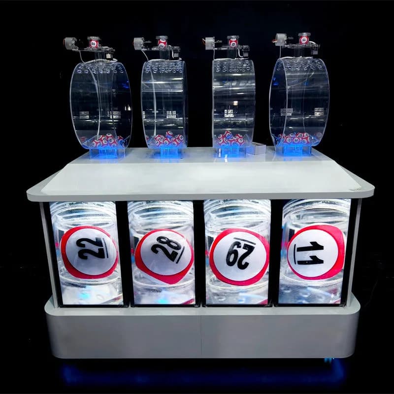Front view of a 4D pick 4 lottery machine with four clear mixing chambers, red numbered balls and blue LED lighting