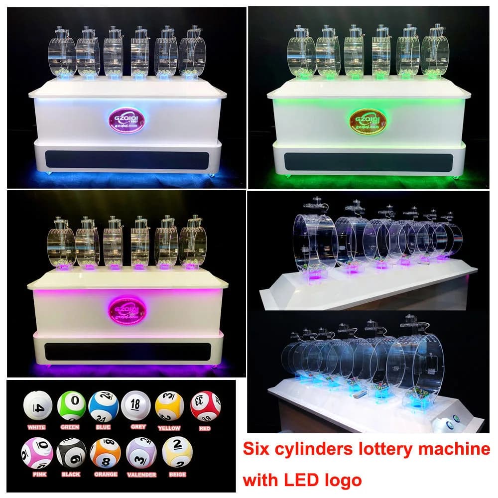 Front and angled views of the six cylinder lotto drawing machine with glowing LED logo, color changing base lights and numbered balls
