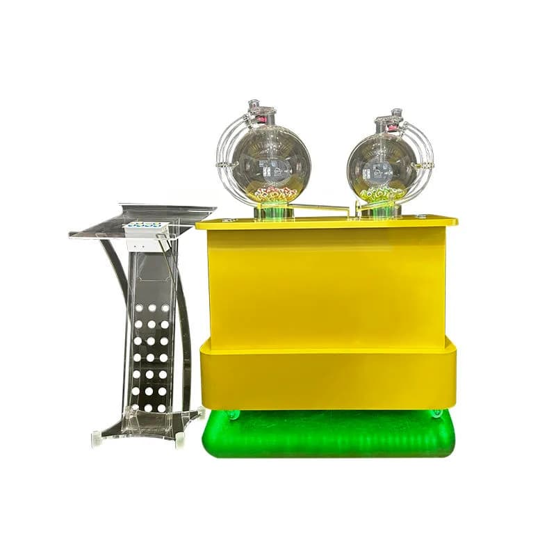 Front view of a yellow dual-chamber 2D lotto machine with two acrylic mixing globes and a separate control podium on a white background